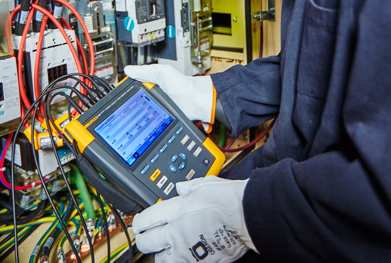 A Husky technician upgrading an injection molding system