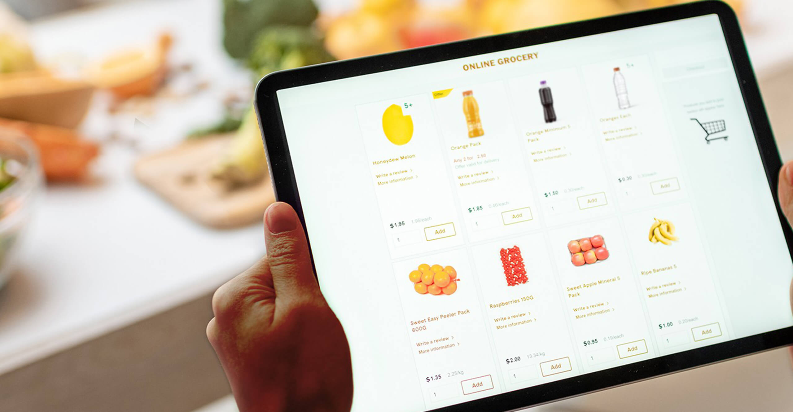 Person using a tablet to shop for beverages and other groceries online